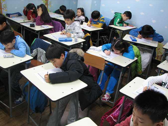 Students taking an exam in school