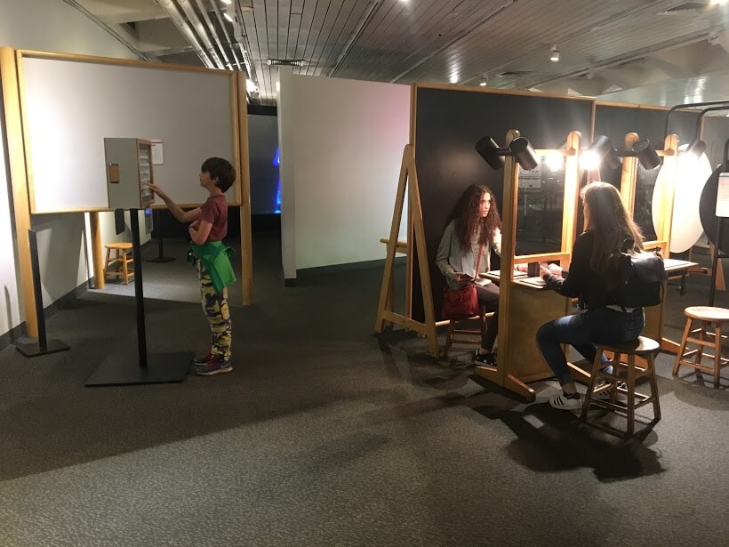 Hugo, Beth, and Hannah checking out the displays