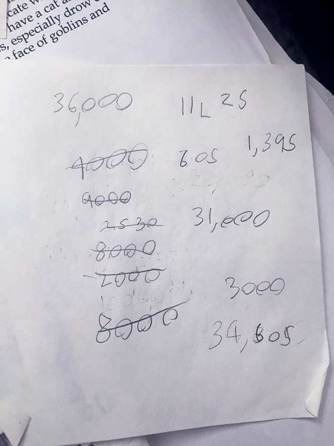 A scrap of paper with math calculations