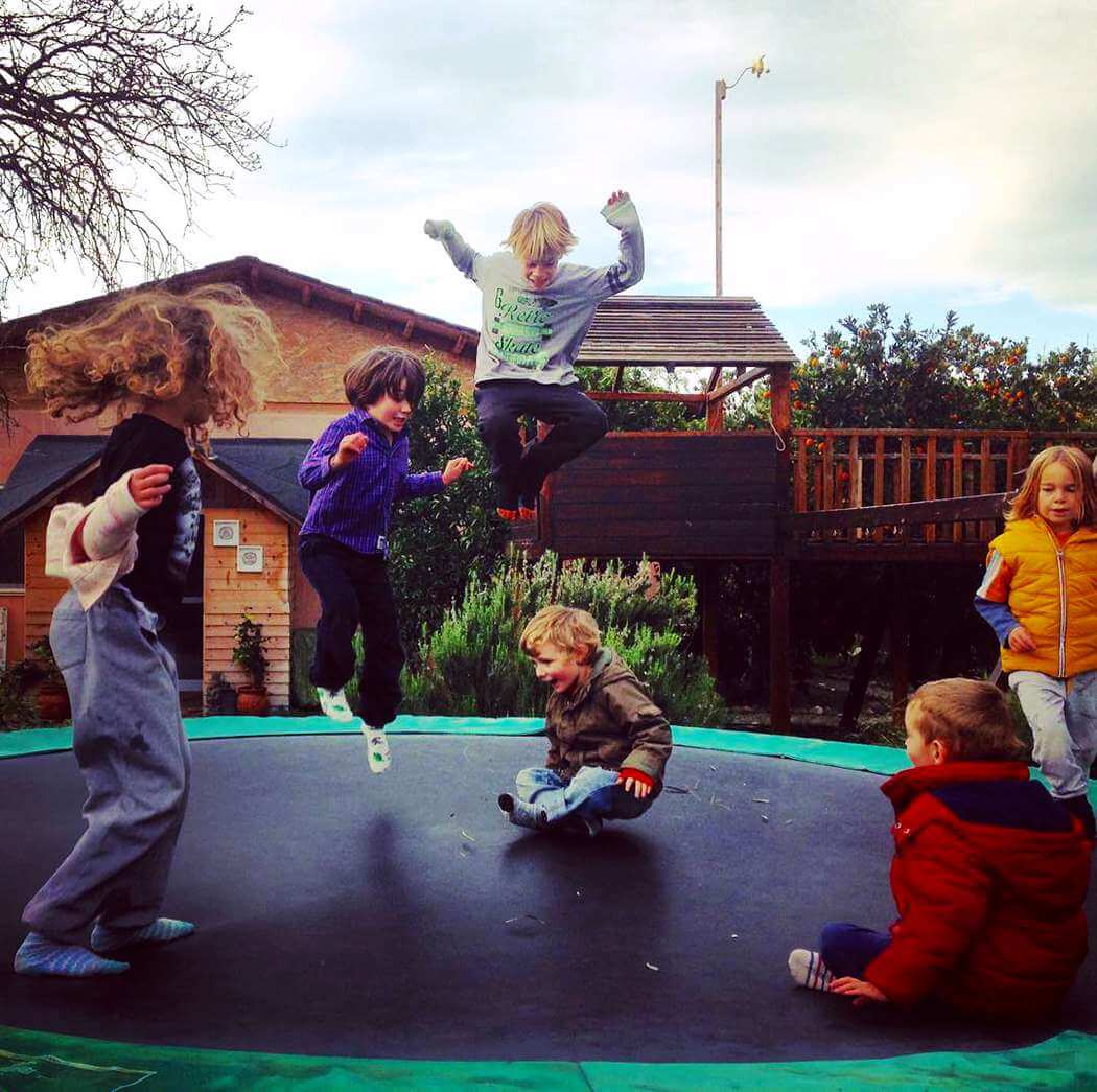 children jumping on a trampoline