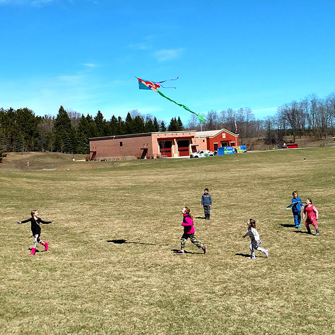 children flying a kite