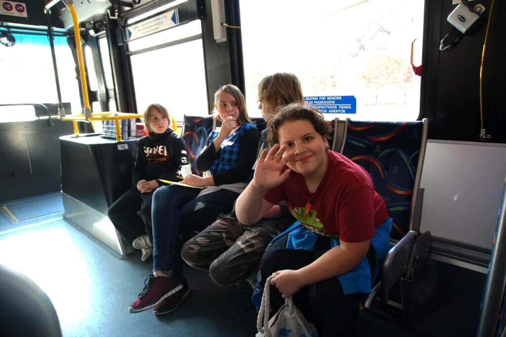 A group of young people on a public bus