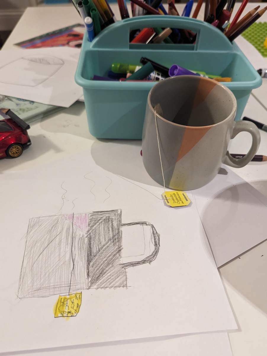 a mug with tea bag next to a drawing of a mug with a tea bag