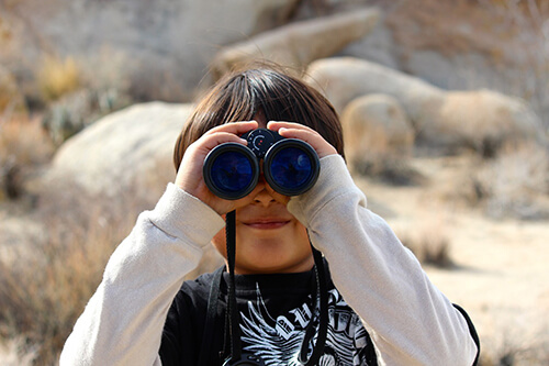 child with binoculars